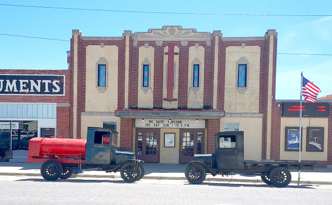 TWO OF THE VEHICLES used for the movie “Paper Moon” were parked outside the Nova Theatre during the 50th-anniversary celebration of the movie filmed in central Kansas. The Rooks County Historical Society hosted the event with guest speakers and memorabilia on hand for the many moviegoers to enjoy.