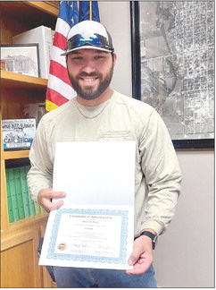 STOCKTON ELECTRIC DEPARTMENT employee Bryce W. Meuli was presented with his Completion of Apprenticeship certificate as a lineman at the Stockton City Commission meeting held on Tuesday, September 5th.
