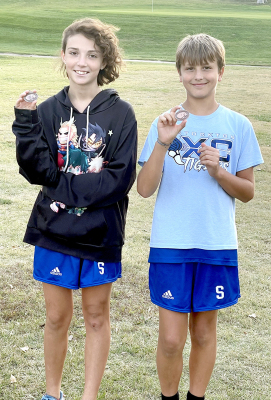 CHRISTINE JURGENS and Kolt Kuhlmann received medals for their performance in the junior high Phillipsburg Invitational cross country meet held last Thursday. Jurgens finished in 11th place in the girls division, while Kuhlmann was 15th in the boys division.