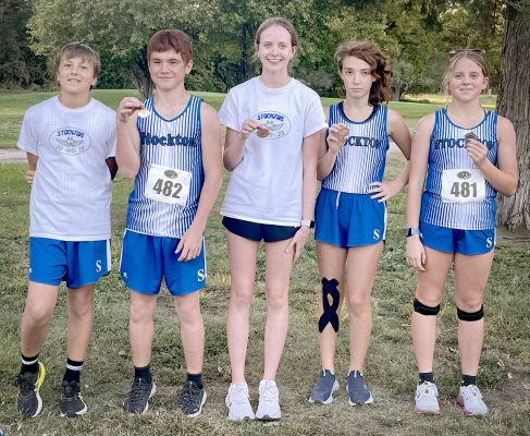 TIGERS BRING HOME HARDWARE! Each member of the Tigers’ high school cross country team brought home hardware from the meet held in Phillipsburg on Thursday, October 5. Junior high runner Kolt Kuhlmann (left) is pictured along with the medalists from left: Zach Chandler (13th JV), Cheyenne Hoeting (11th), Chrissy Jurgens (10th JV), and Mia Odle (2nd JV).