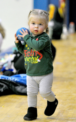 HARPER KELLER looks to pass the ball to whoever is willing to play with her, despite the fact there was already a basketball game going on between the Stockton Tigers and Hoxie Indians Friday night, February 3. Harper is the daughter of Anthony and Ali Keller.