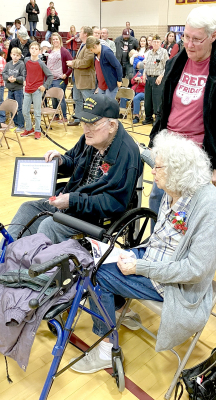 FORMER WOODSTON RESIDENT Robert (Bob) McCall was honored for his WWII service to his country on Friday, November 11th. He received the Certificate of Merit and was recognized as the oldest veteran they knew. The Osborne VFW Auxiliary conducted the Veteran’s Day program. Those in attendance were his wife, Edna McCall (pictured with Bob); son-in-law Travis Sullivan and three friends from Emporia; Ron and Diane Keirns, Stockton; and Brinda Han (picture upper right) and her daughter, Rebecca of Osborne. The pro