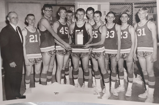 THIS 1967 PICTURE shows the Mid-Continent League Champions (front row): Head Coach John Locke, Ronnie Jackson, Bruce Stewart, Mike Jones, Greg Stice, Kelly Desmarteau, James Berkley, Butch Look, Craig Phelps; (back row) Jim Walker and Tony McReynolds. The boys, who were the MCL Champions three years in a row were coached by John Locke (far left) and assisted by Jack Miller (not pictured).