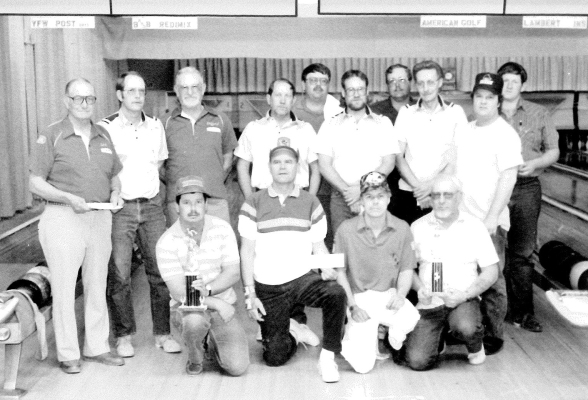 FOURTEEN STOCKTON BOWLERS participated in a tournament in Grand Island and did quite well back in April of 1991. Pictured are (front row, from left): Darwin Carswell, Don Swanson, Robby Lambert, Emery Schilowsky; (middle row) Earl Richardson, Donnie Johnston, Clifford Roy, Merrill Johnston, Delwin LaRue, Bob Lambert, Jerry Sterling; (back row) Tony Terry, Neil Biery, and Jerry Glassman.