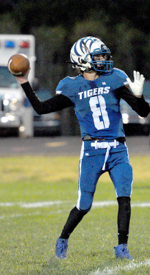 SHS QUARTERBACK MAX MOFFET looks downfield for his receiver during the Tigers’ Homecoming game against the Decatur Community Red Devils last Friday evening.