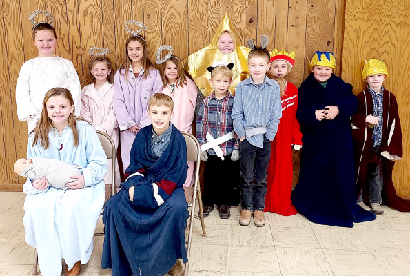 THE ST. THOMAS PSR KIDS performed a Nativity play for their parents, family and friends after church on Sunday, December 11th at the Parish Center. Pictured are (sitting, from left): Remy Muir holding Baby Jesus, Henry Berkley; (second row, from left) Tessa Look, Norah Muir, Harper Lowry, Charlotte Berkley, Carson Riener, Ira Beall; (back row) Lily Yohon, Emery Peterson, Trent Look and Orin Beall.