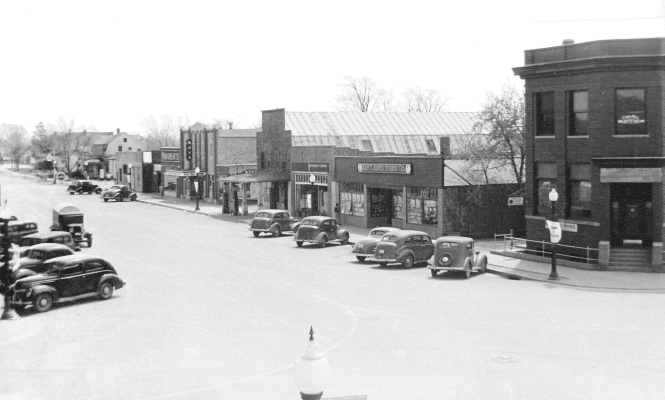 WITH THE RECENT DEMOLITION WITH THE RECENT DEMOLITION of the Trading Post building in Stockton, LoraBelle Sander brought in a picture of Main Street (1940s?) showing when the building housed the Ray T. Jones Stores, Co. Notice that the Rooks County Record building and the Trading Post building are both standing back then, but the Mapes and Miller building, which was built between the two structures years later, is now the only one of the three standing. According to LoraBelle, the space between the two buil