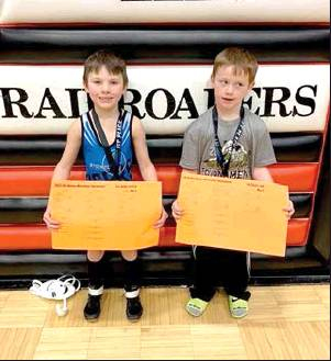 ELI ATKISSON (left) and Cole Flower both wrestled their way to the champion spot in their weight classes at the Ellis Novice Tournament on Sunday, January 19th.