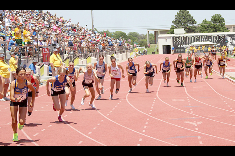 THE FIELD OF 16 RACERS for the 1600 Meter Run take off at the sound of the shotgun at the 2024 KSHSAA State Track and Field Championships held in Wichita. Stockton sophomore Cheyenne Hoeting (sixth from left) placed 10th in Saturday’s race. (Photo Courtesy of Jerry Clarke, Ness County News)