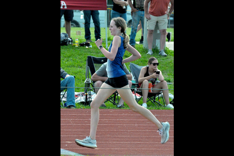 CHEYENNE HOETING eyes the finish line of the 1600M Run at Regionals held last Thursday in Washington. Hoeting not only qualified for State in the event, but she also set a new school record.