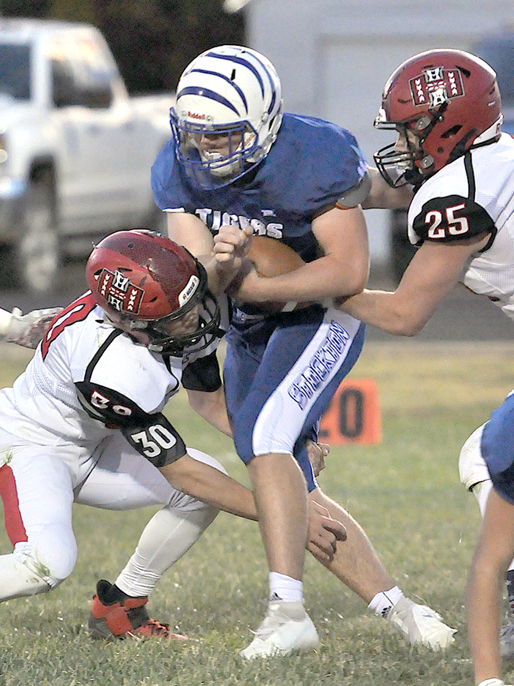 TROY ROGERS holds on tightly to the ball as he breaks the tackles of his Hoxie defendrs in the October 23 district match-up.