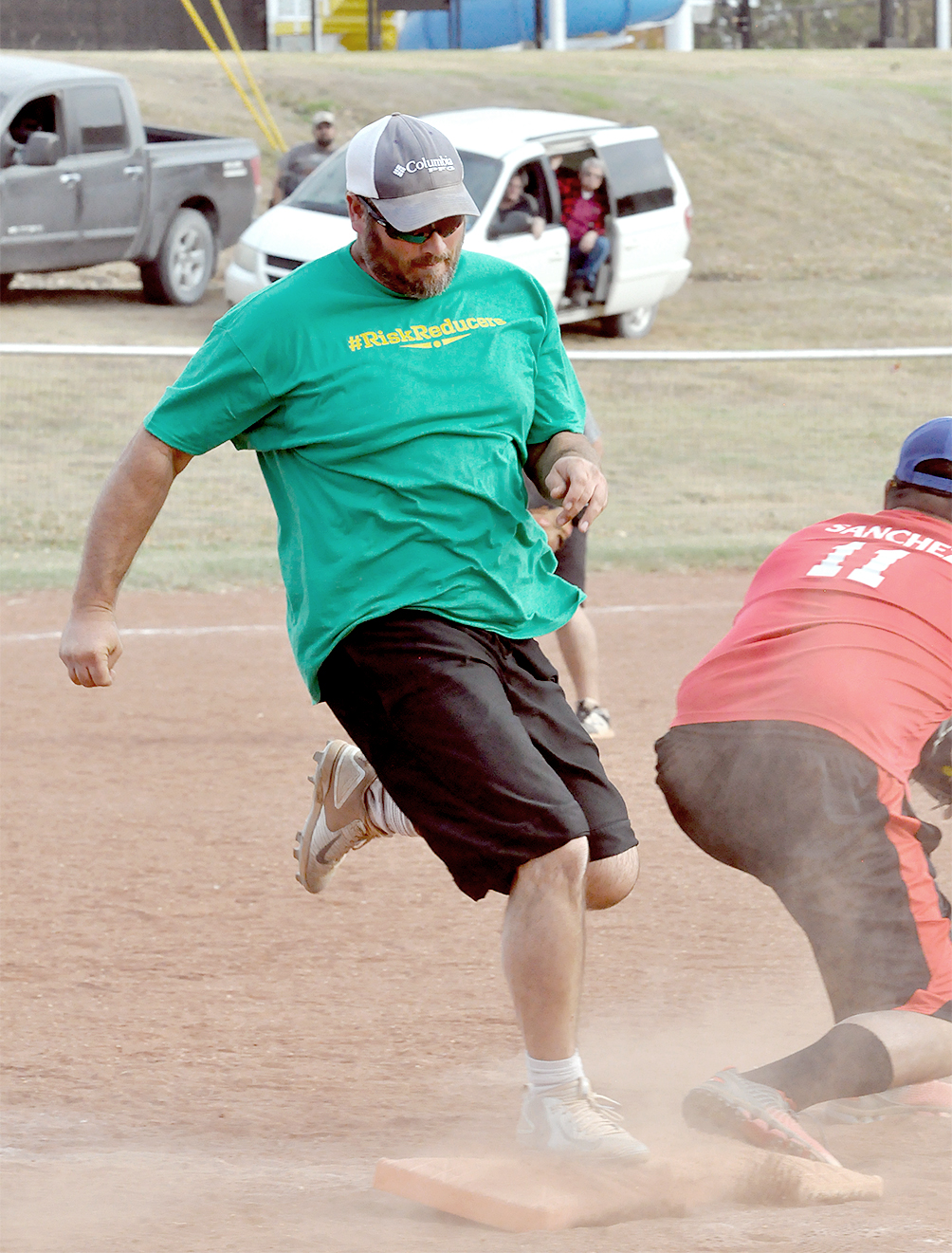ZACH KESLER, beats out the throw to first base during the championship game of the Adult Softball Tournament held on Saturday. The #RiskReducers, sponsored by Heritage Insurance Group, Inc., defeated M.B.P. out of Great Bend to capture the trophy.